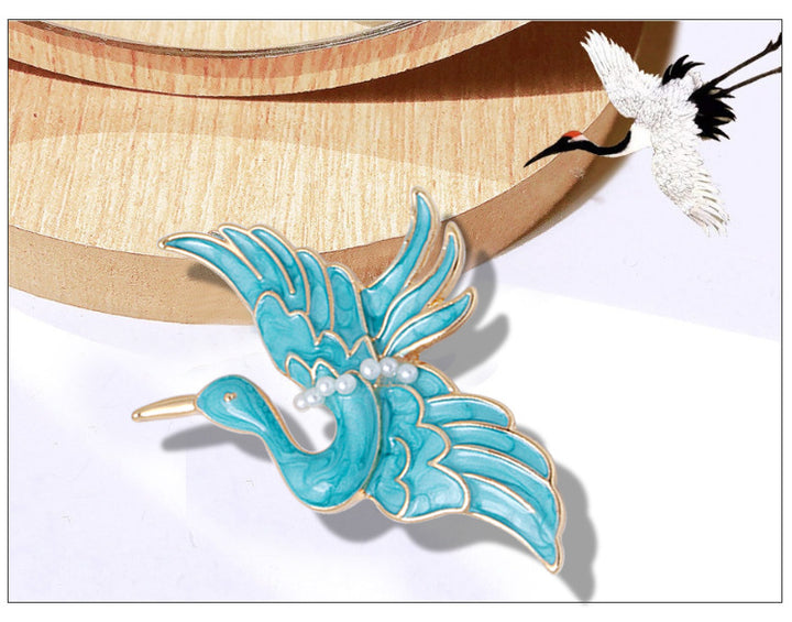 Women’s Blue Crane Enamel Brooch | بروش نسائي أزرق بتصميم طائر الكركي
