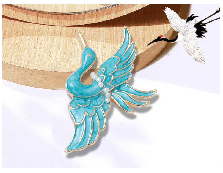 Women’s Blue Crane Enamel Brooch | بروش نسائي أزرق بتصميم طائر الكركي