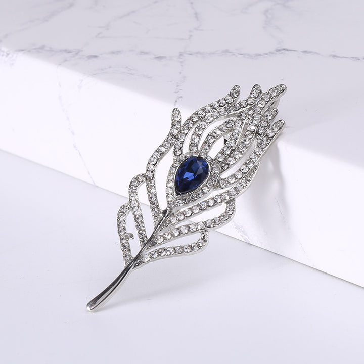 Women’s Rhinestone Feather Brooch | بروش نسائي مرصع بتصميم ريشة أنيقة