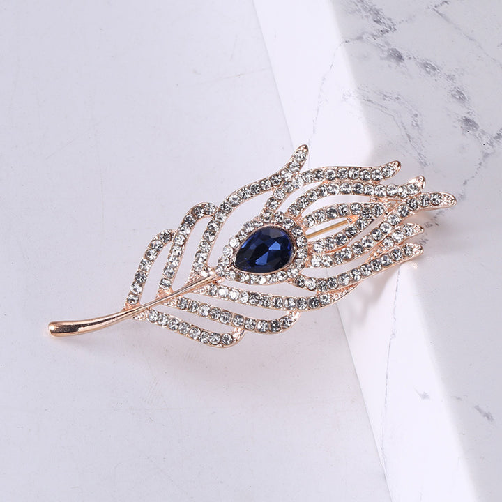 Women’s Rhinestone Feather Brooch | بروش نسائي مرصع بتصميم ريشة أنيقة